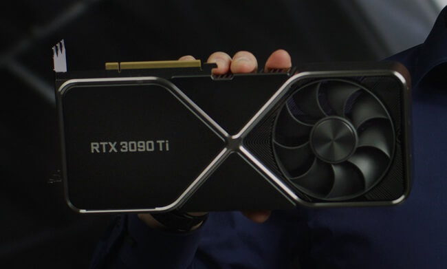 Close up of someone holding an Nvidia RTX 3090 Ti towards the camera