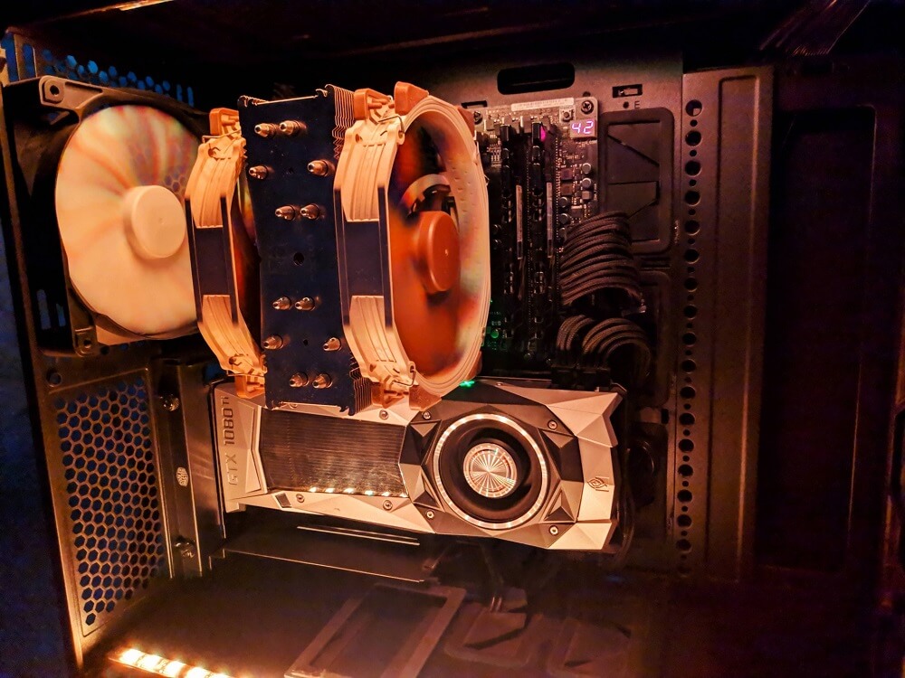Image of inside a PC that shows a big Noctua CPU cooler and a rear exhaust fan
