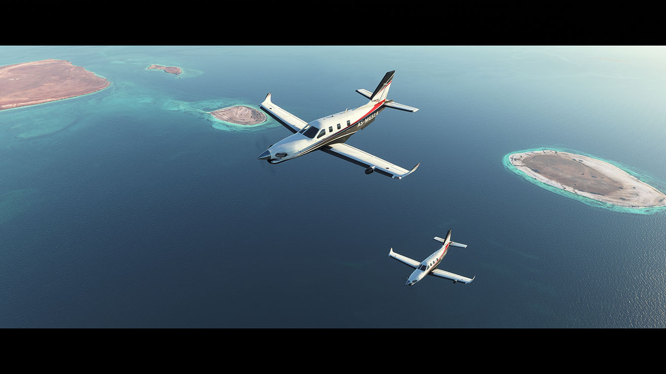 Screen capture image from Microsoft Flight Simulator 2020 showing two planes flying together across the ocean 