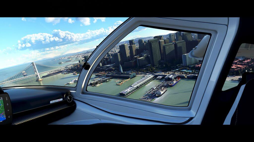 Screen capture image from Microsoft Flight Simulator 2020 from inside a cockpit looking down at a city and harbour below