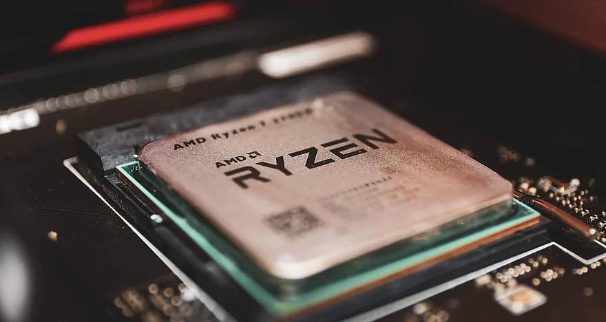 An extreme close up of an AMD Ryzen CPU in a motherboard