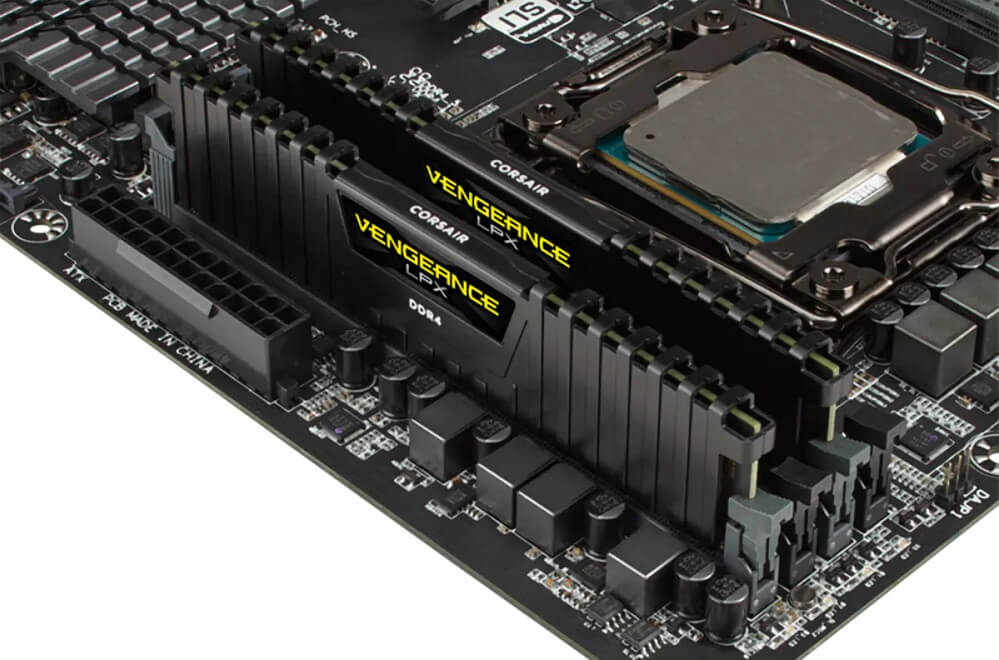 Image of 2 sticks of Corsair Vengeance LPX RAM plugged into a motherboard